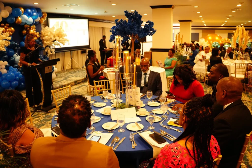 Guests at round tables in the ballroom at the celebration of Bishop McFarlane’s 40 years of pastoral ministry.