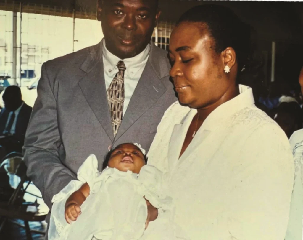 A young Bishop McFarlane and his wife Marlene with their newborn daughter Abigail