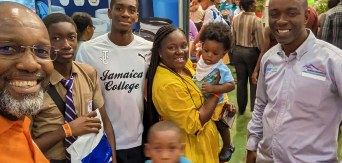NFCM men with young people, including a Jamaica College student, at a church event