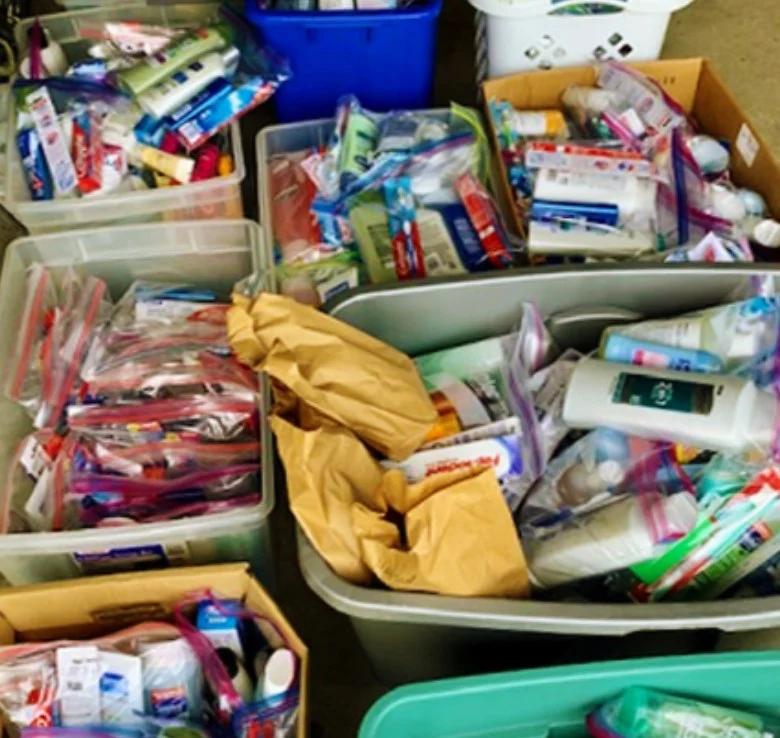 Bins of toiletries and care packages packed by the NFCM Social Outreach team