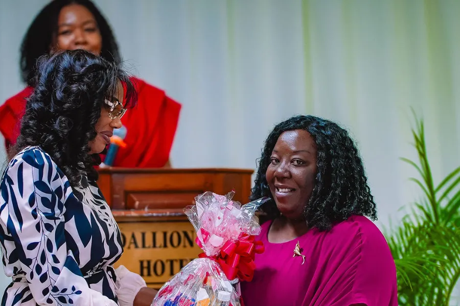 Members present a gift basket at the NFCM Prayer Breakfast 2026.